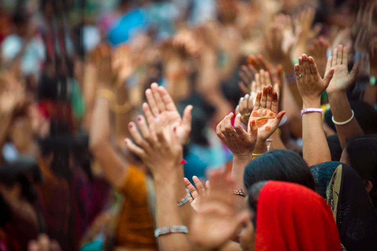 Hands raised in a crowd