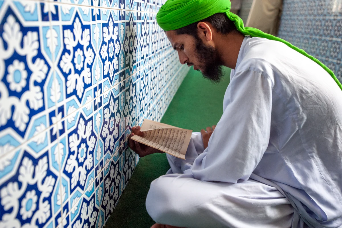 A man reading in a place of worship