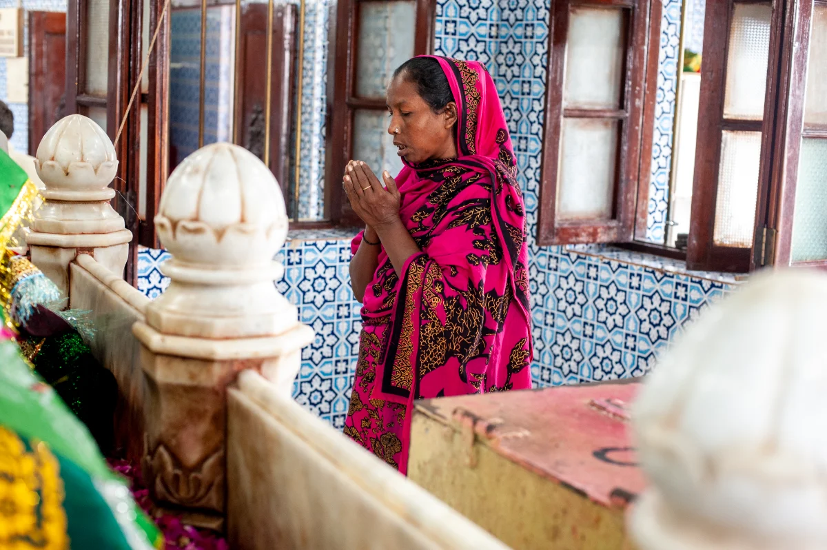 A woman praying at a shrine